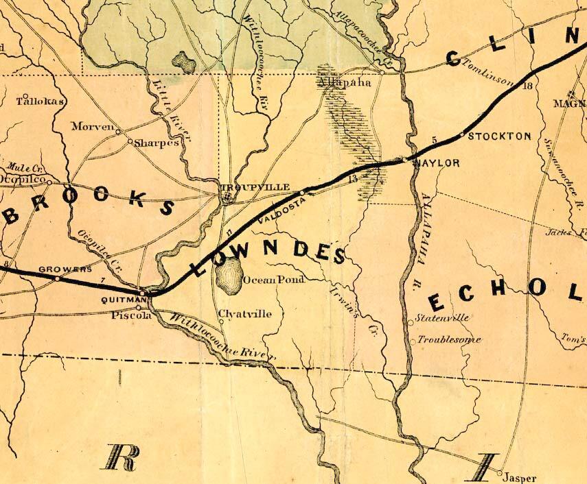 Lowndes County, 1864, GeorgiaInfo, with most of the current river names: “Withlocoochee Riv.”, “Little River”, “Ocopilco Cr.” Troupville is still marked as substantial, but Valdosta is on the railroad. And “Irwin’s Cr.” sstill appears instead of Alapahoochee River, with an old spelling of where it goes: “Allapaha R.”