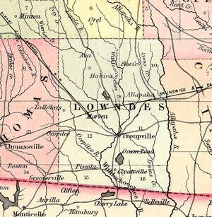 [Lowndes County, 1855, GeorgiaInfo, with Troupville on (the wrong bank of) the “Withloocoochee R.”, which towards the state line is marked with an extra “ch” as “Withlochoochee”. Okapilco Creek is marked “Ocopilco R.”, and the Little River is not named. The towns of Hahira, Morven, Ocopilco (apparently where Quitman would be), Clyattville, Ocean Pond, Cherry Lake, and Belleville have appeared, along with now-forgotten ones such as Ava, Tallokas, Grooverville, and Piscola. Also, the Alapahoochee River is marked “Irwins Cr.”, and the town of Allapaha has appeared upstream, or is that Ray City?]