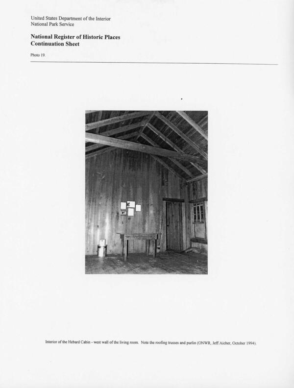 Photo 19: Interior of the Hebard Cabin - west wall of the living room. Note the roofing trusses and purlin (ONWR, Jeff Aicher, October 1994).