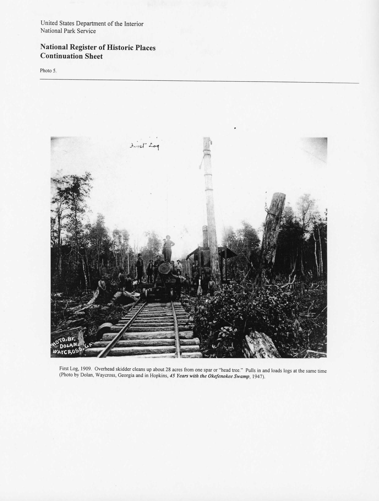 Photo 5: First Log, 1909. Overhead skidder cleans up about 28 acres from one spar or “head tree.” Pulls in and loads logs at the same time (Photo by Dolan, Waycross, Georgia and in Hopkins, 45 Years with the Okefenokee Swamp, 1947)