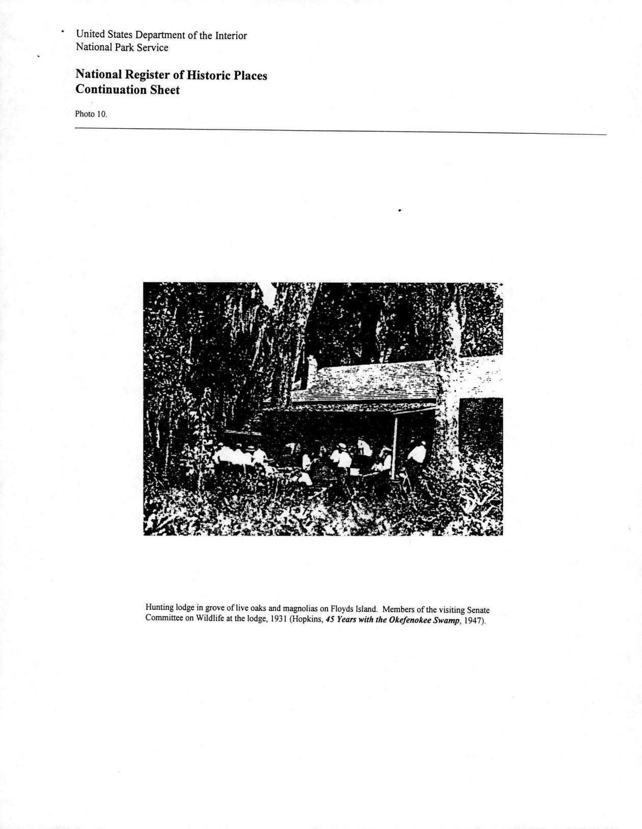 Photo 10: Hunting lodge in grove of live oaks and magnolias on Floyds Island. Members of the visiting Senate Committee on Wildlife at the lodge, 1931 (Hopkins, 45 Years with the Okefenokee Swamp, 1947)