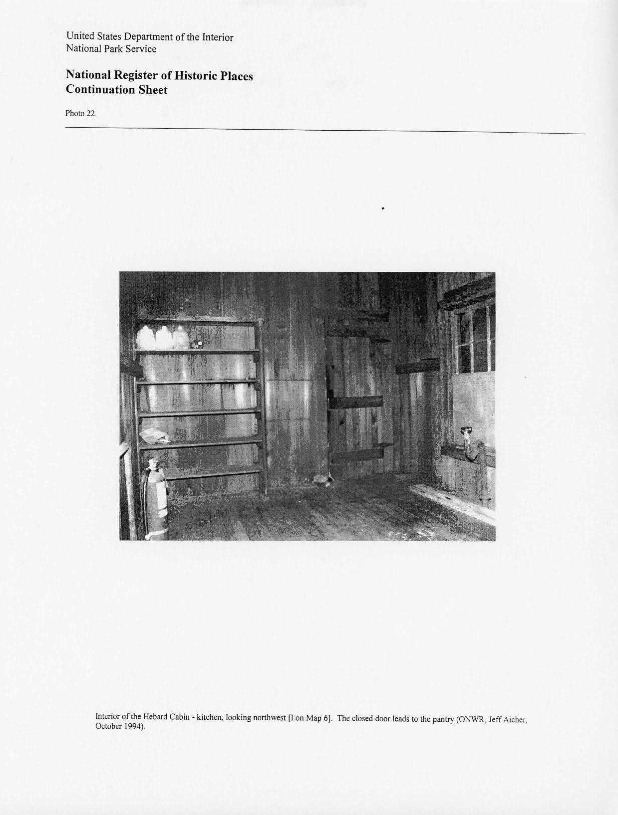 Photo 22: Interior of the Hebard Cabin - kitchen, looking northwest {I on Map 6]. The closed door leads to the pantry (ONWR, Jeff Aicher, October 1994).