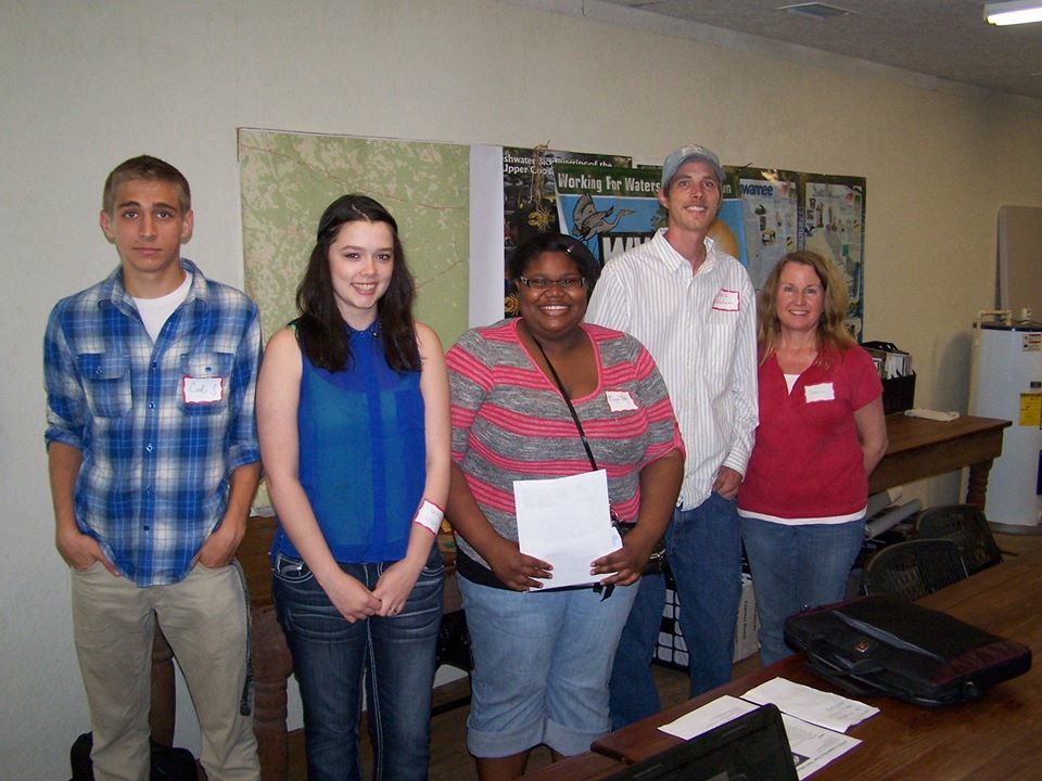 The winners: Honorable Mention Codi Sadler, Second Place Taarna Jones, First Place Maya Turner. Third Place Glenda Velasquez not pictured, plus ARWT Chair Chris Graham and logo contest coordinator Deanna Mericle