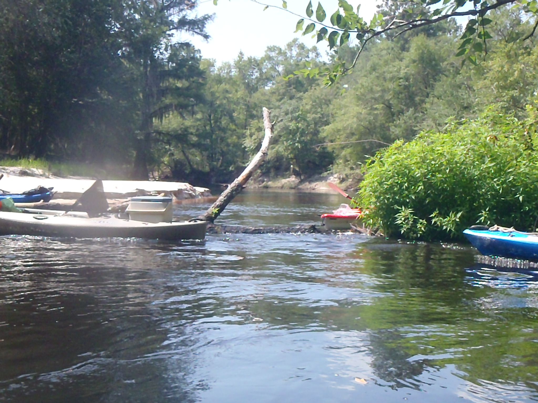 Red boat boofing across log --GQ C1, 10:28:51