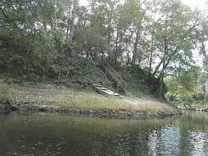 [A boat at a bend in the river 30.5337410, -83.2490692]