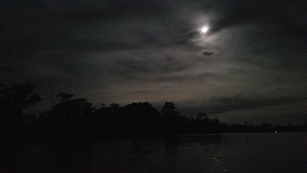 Moon over dark cloud