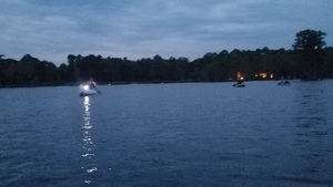 [Paddlers and the lights of Banks Lake Outpost behind them]