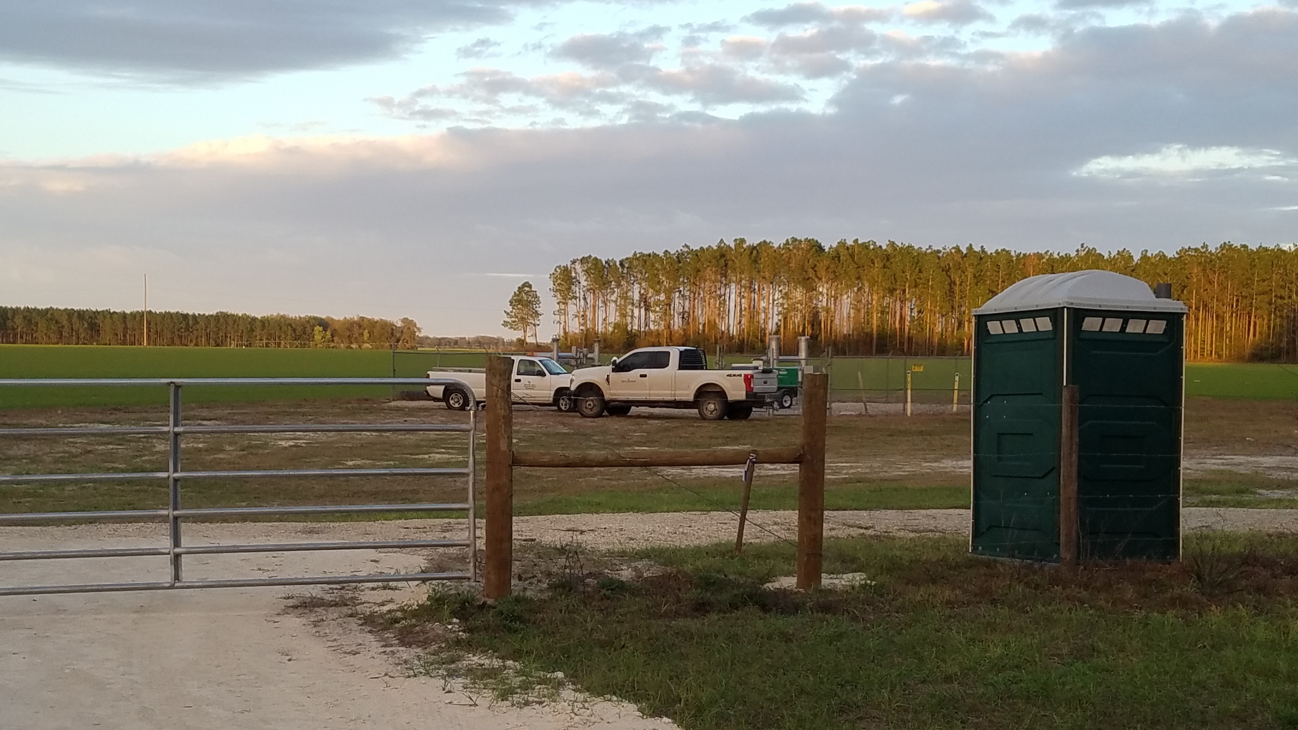 Two trucks and portapotty, 18:15:30, 30.0715636, -83.0537673