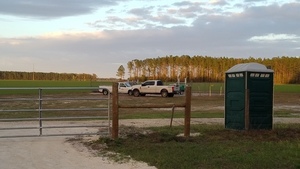 [Two trucks and portapotty, 18:15:30, 30.0715636, -83.0537673]