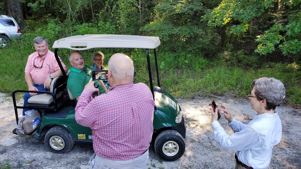 Don and Helen photographing golf cart VIPs, 08:44:11, 30.84721, -83.34752