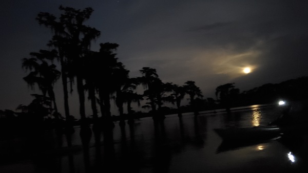 [Boat lights and moon]