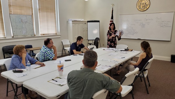 [Clockwise from left: Ouida Johnson, Homeland Mayor; Pender Lloyd, Folkston City Manager; Hampton Raulerson, Charlton County Administrator; Elizabeth Backe, SGRC; Laura Early, Satilla Riverkeeper; John S. Quarterman (hat), Suwannee Riverkeeper; Blair Nixon, Homeland City Council Post 4.]