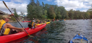 [New paddlers in the red boat]