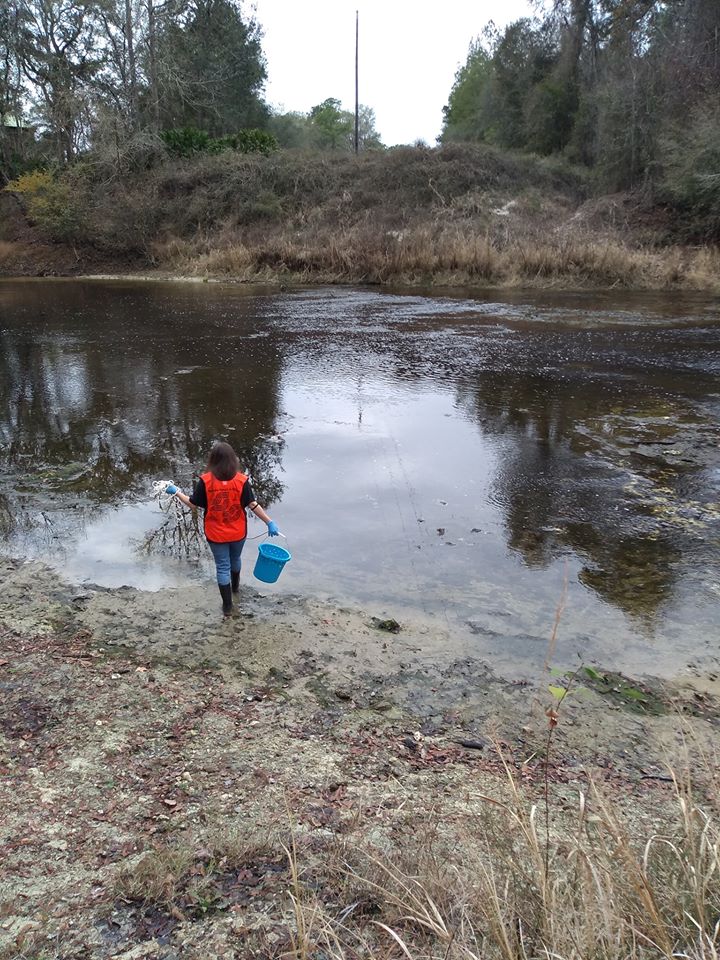 Sara casting bucket below Spook Bridge