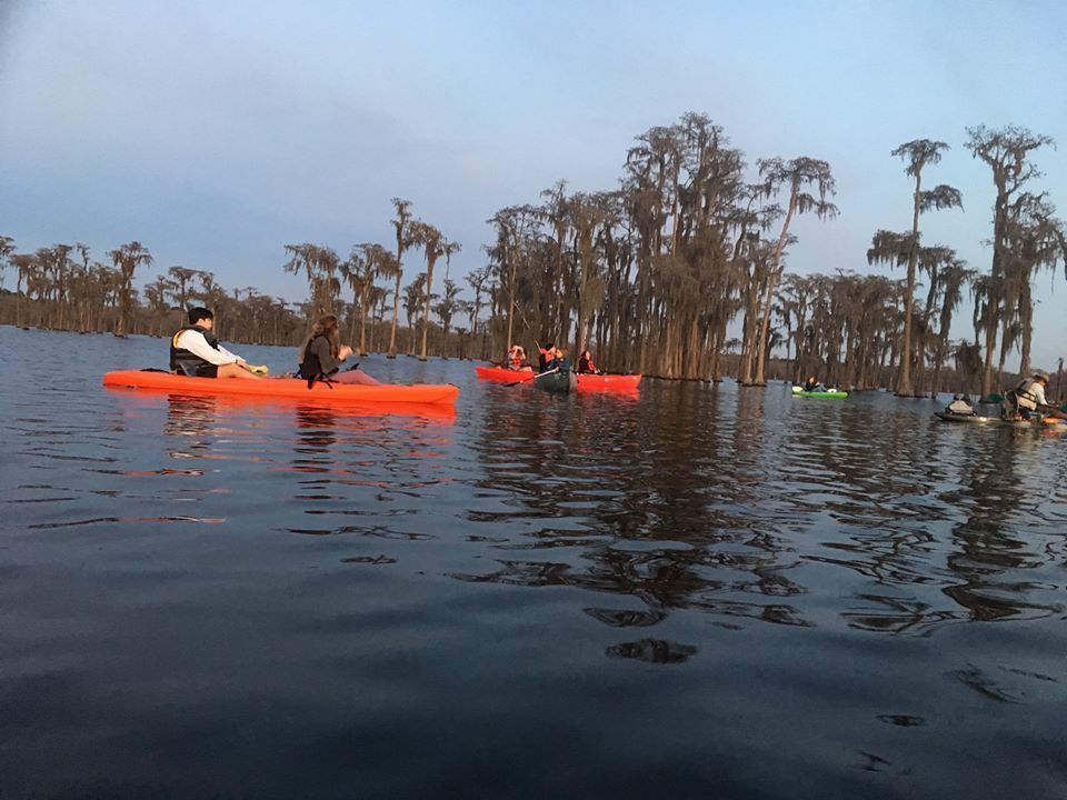 Paddlers golden in sunset