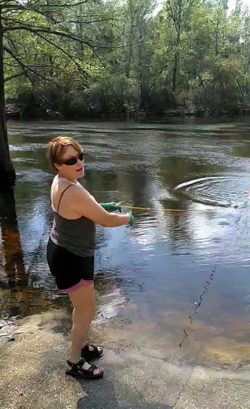 Suzy Hall retrieving test bucket at State Line Ramp 2020-03-22