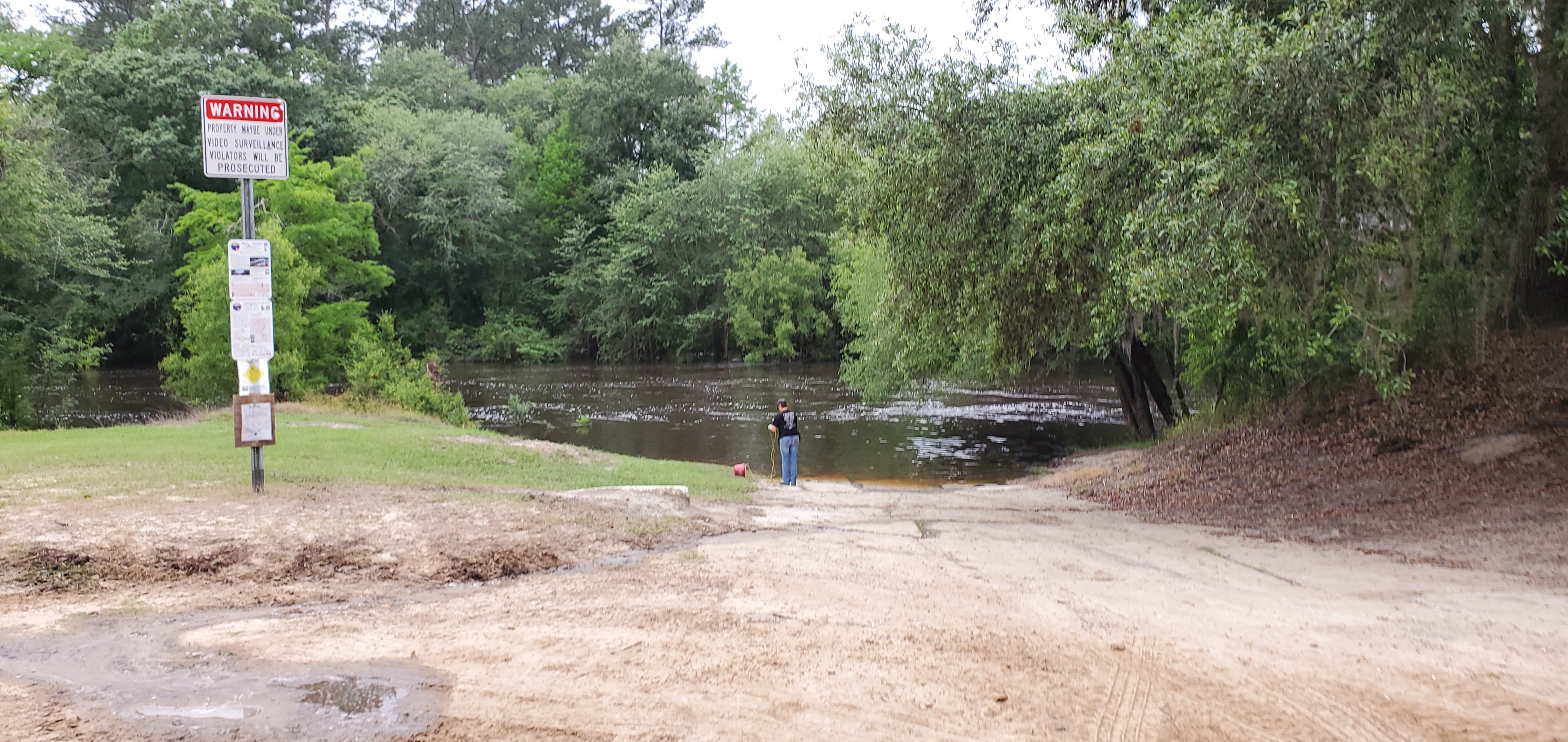 Jsq: Suzy Hall with a bucket at Nankin Boat Ramp