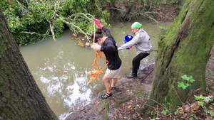 [Movie: Scotti fishing for trash with bucket (163M)]