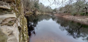 [River downstream through window]