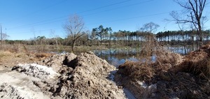 [Sand pile and lake]