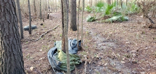 [Remains of camping gear on Old Broad Street, 08:25:00, 30.8490050, -83.3459380]