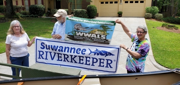 [Canoe donor Sue Raffaele, Suwannee Riverkeeper John S. Quarterman, WWALS E.D. Gretchen Quarterman]