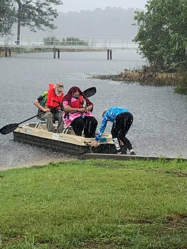 Fannie Gibbs in a boat in the rain