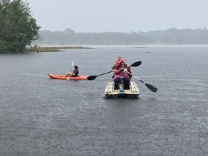 [Fannie with a paddle in a boat]