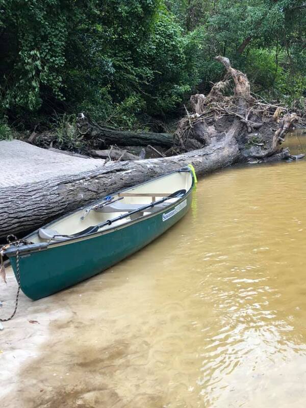 [Suwannee Riverkeeper canoe at NSFRR logjam by Russell McBride]