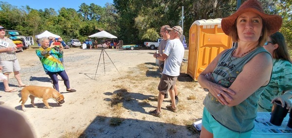 0:58:43 Gretchen photographing Lloyd Reeves with the check