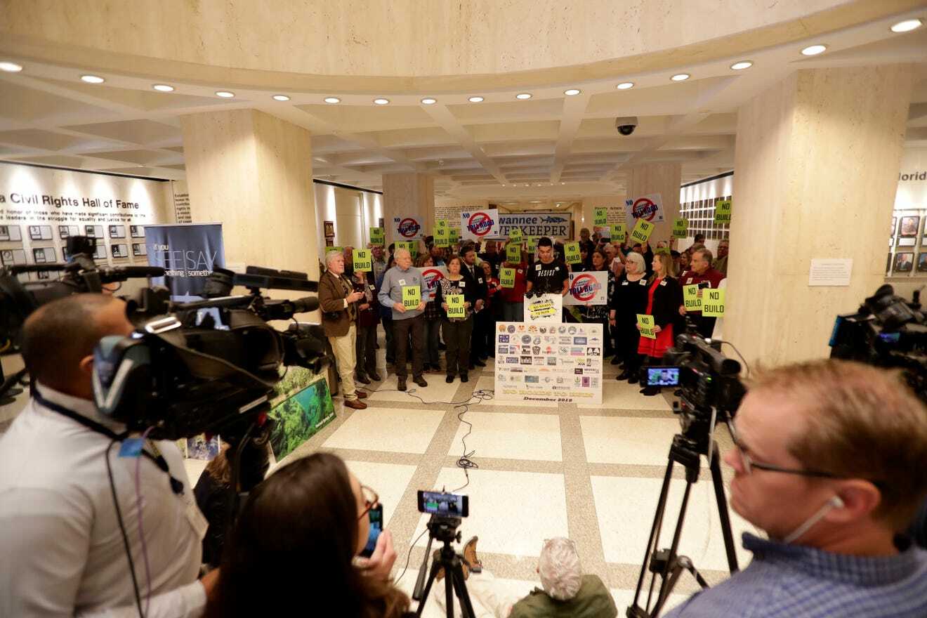 Suwannee Riverkeeper banner at NRTR press conference, FL Capitol Rotunda --Alicia Devine/Tallhassee Democrat, 2021-03-03