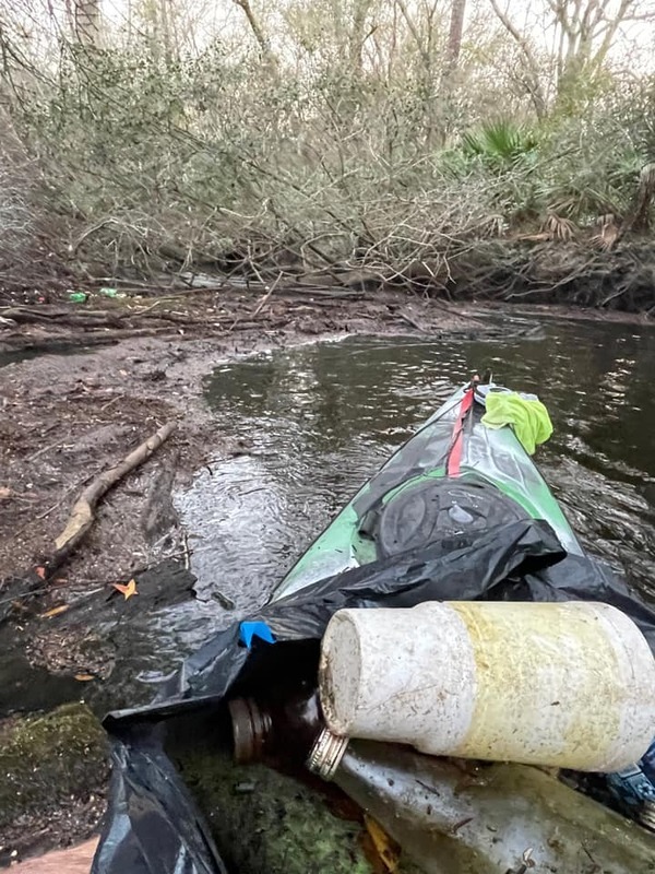 [Trash in boat, Withlacoochee River, downstream from Threemile Branch 2022-02-14 Photo: Bobby McKenzie]