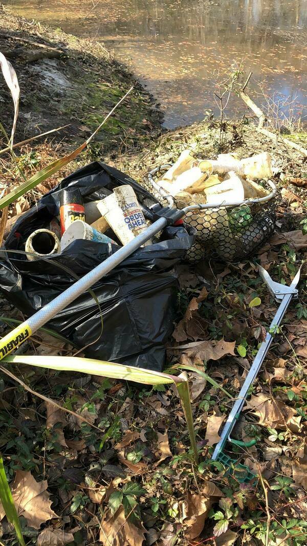 [Trash on shore Sugar Creek 2022-02-15 Photo: Russell McBride]