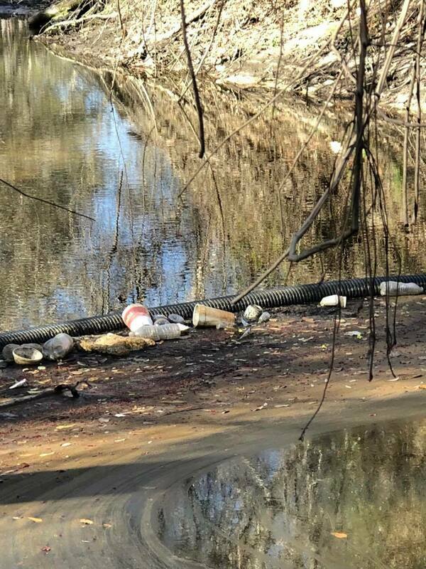 [Trash at boom Sugar Creek 2022-02-20 Photo: Russell McBride]