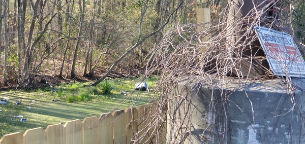 Trash in water behind No Dumping sign, 09:32:04, 30.6406656, -83.1885083