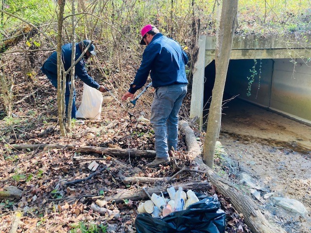 Picking up litter at Country Club Drive Bridge