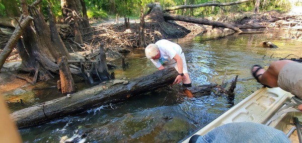 [Phil Hubbard and a log]