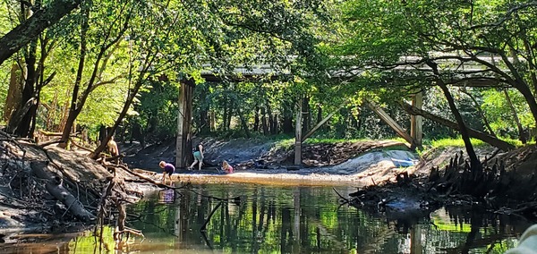 [Elizabeth Brunner and family picking up trash at the RR trestle]