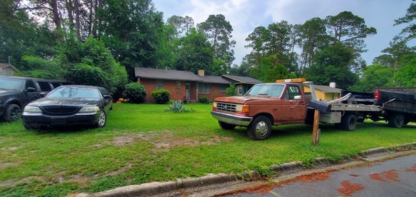 [Vehicles parked on Holly Street yard]