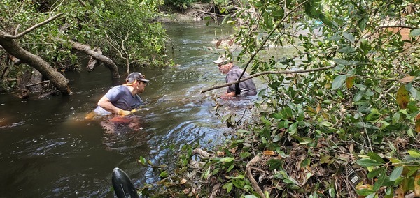 [Grant and Bobby fishing for a dropped saw, 11:05:33, 30.8614087, -83.3234156]