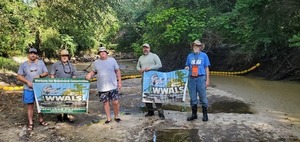 [Banners: Grant and Art Herring, Shawn O'Connor, Bobby McKenzie, Suwannee Riverkeeper John S. Quarterman, , 09:05:54, 30.8624109, -83.3185604]