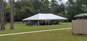 [context: Dignitaries lunching in a tent, 12:23:21, 30.7385786, -82.1401877]