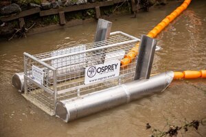 [Osprey net detail. Will Stormwater modify their homemade device to include a cage/fence/net modification on top to keep trash from sliding over the boom?]