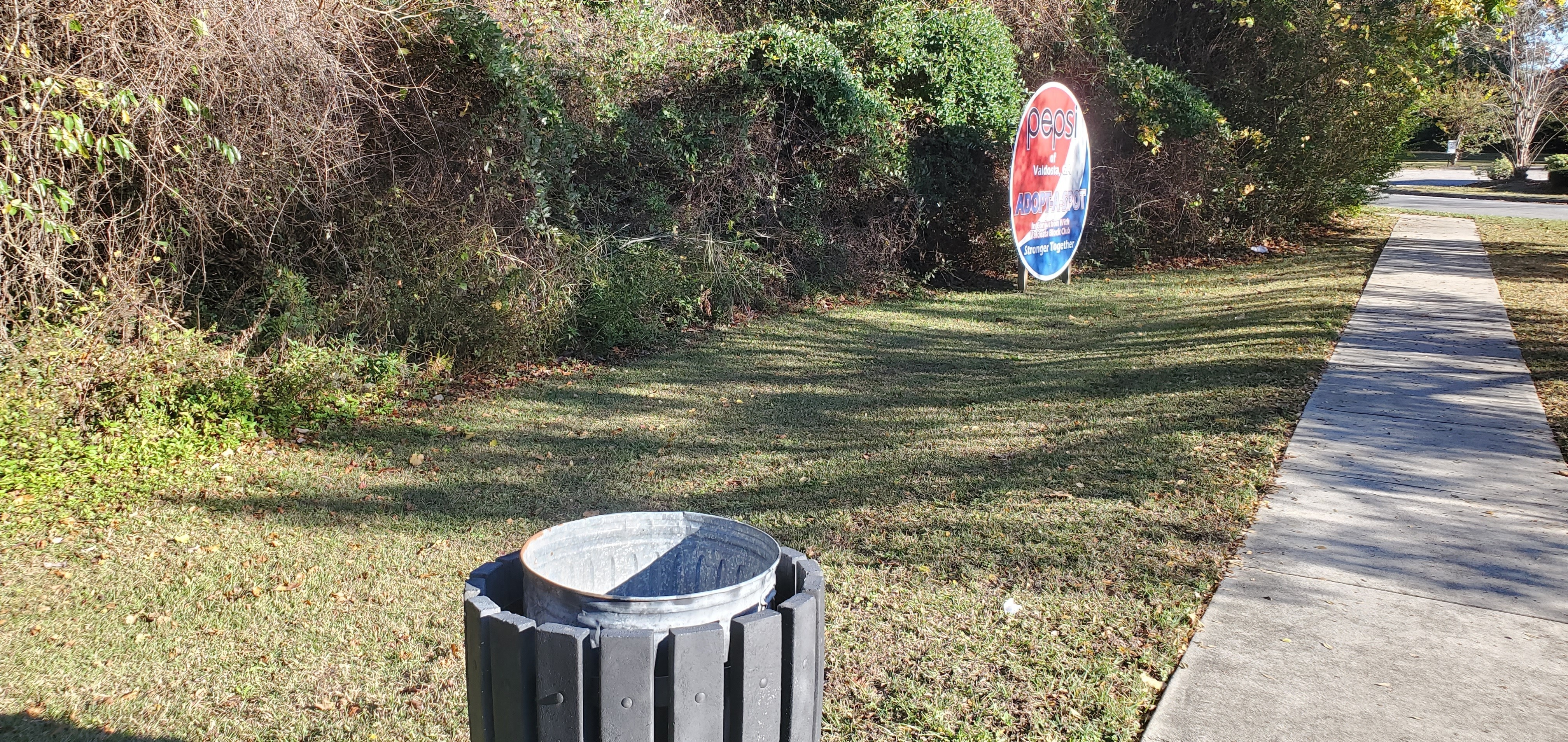 Trash can and Adopt-A-Spot sign, 2022:12:01 15:20:12, 30.8539524, -83.2654312