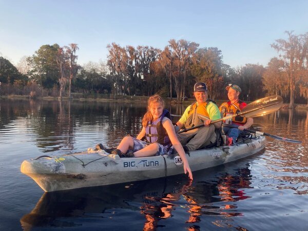 [Holly Jones and family in the kayak she won --Gretchen Quarterman]