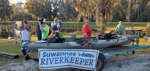 [Holly Jones inspects her new kayak]