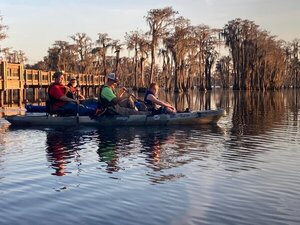 [Holly Jones and the kayak she won at the dock --Gretchen Quarterman]