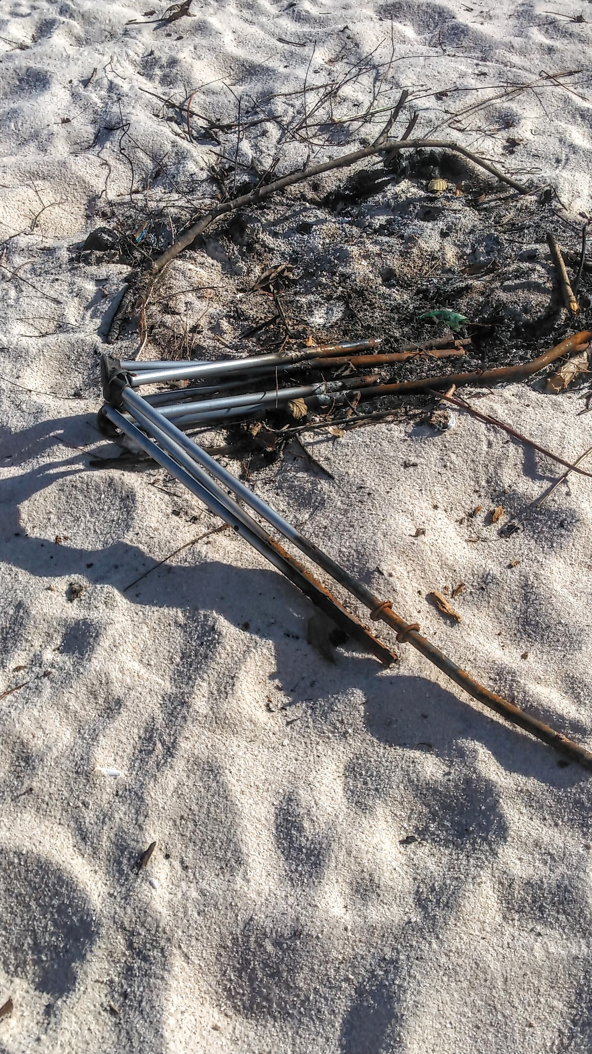 Burnt chair on beach --Suzy Hall