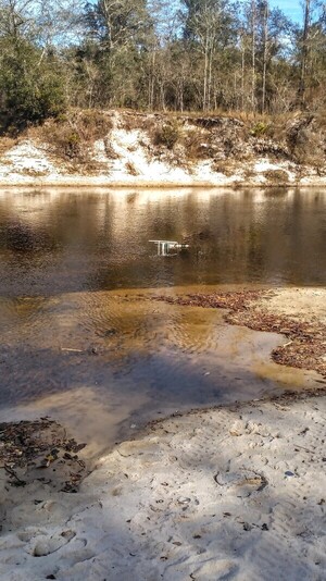 [Chair in river --Suzy Hall]