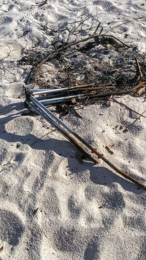 [Burnt chair on beach --Suzy Hall]